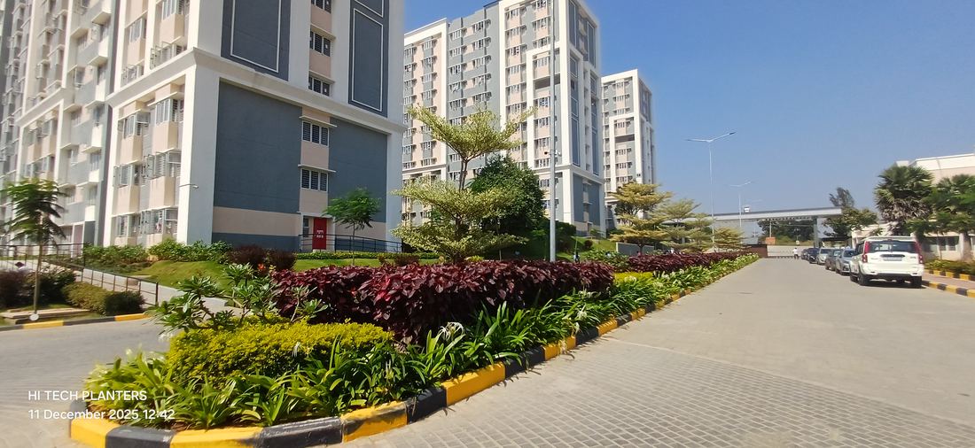 Podium-level garden beds at a residential tower community