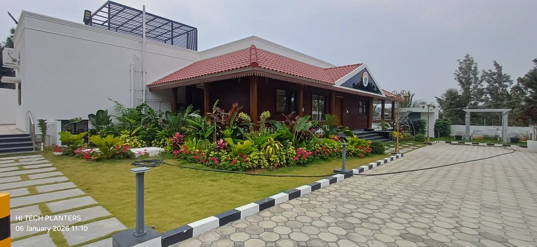 Resort-style clubhouse with tropical landscaping